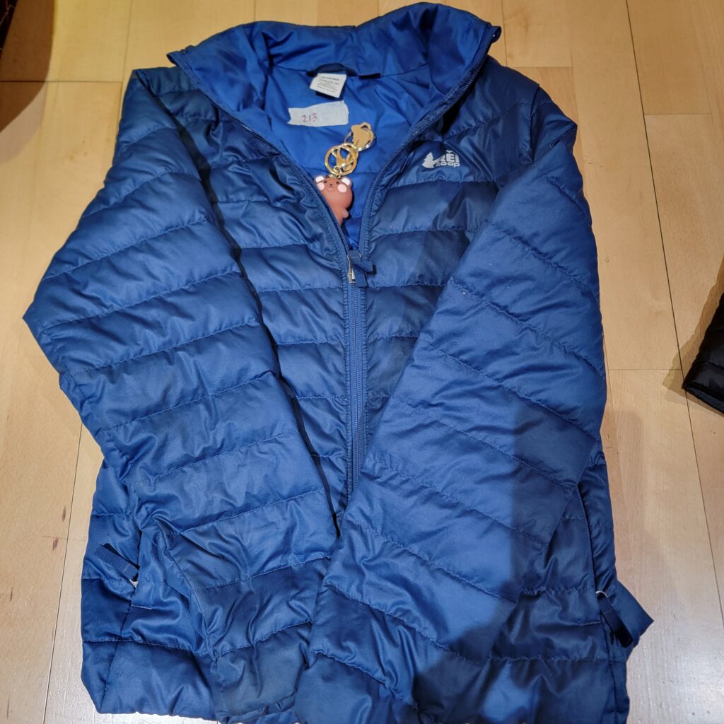 213-Blue-Puffer-Coat-with-Bear-Keychain-In-Pocket-Main