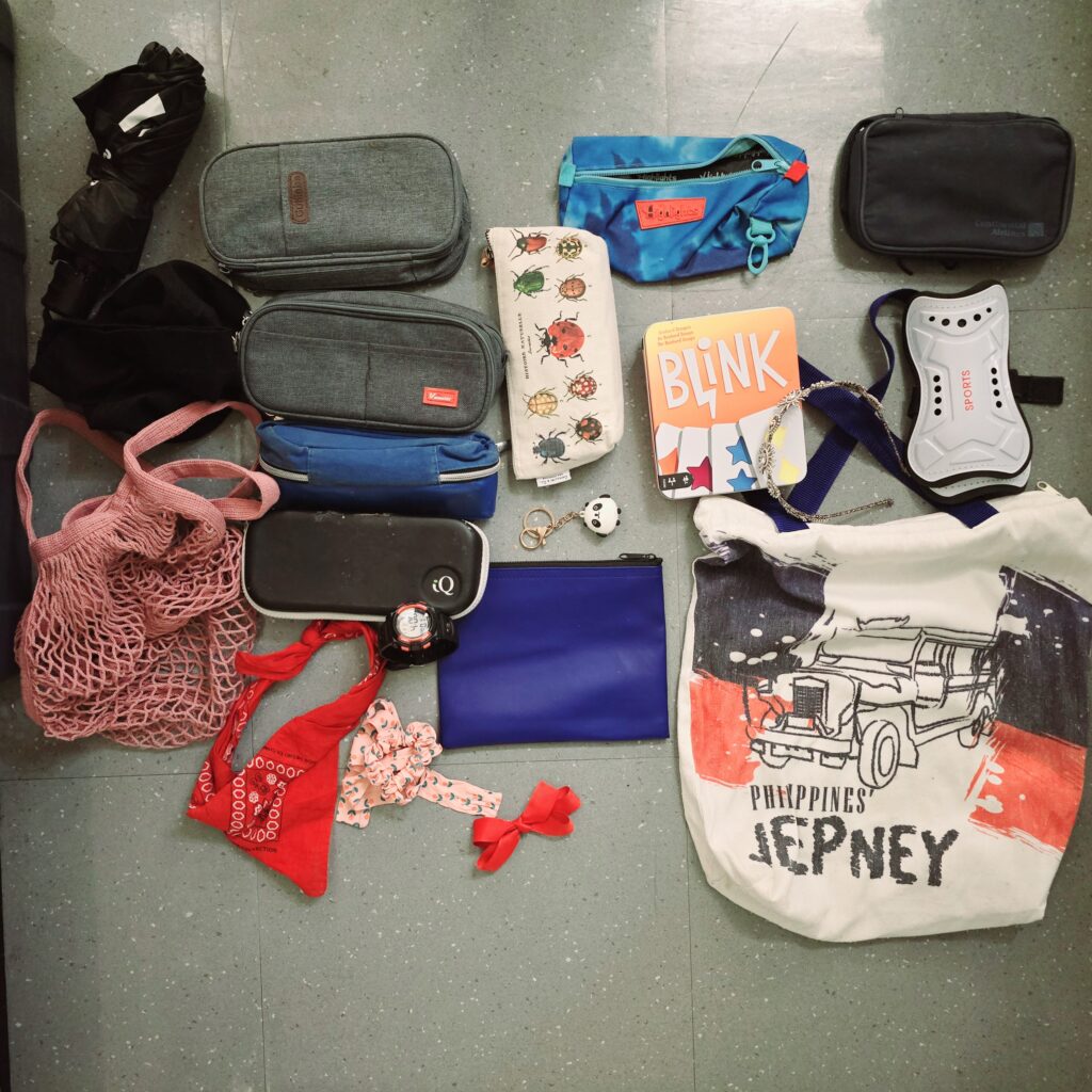 502-Pencil-Cases-Umbrellas-and-other-Items-in-the-Bin-by-the-Trophy-Case-2-21-Main